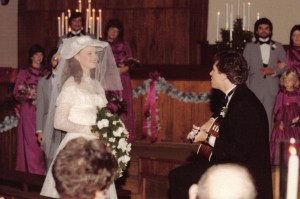 Our wedding day --  We began our marriage with a church full of friends, a precious time of prayer and a John Denver song.