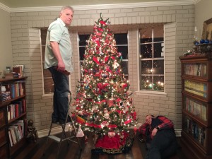 Almost done.  Larry was getting ready to top the tree and Logan was waiting so he could finish the tree skirt.