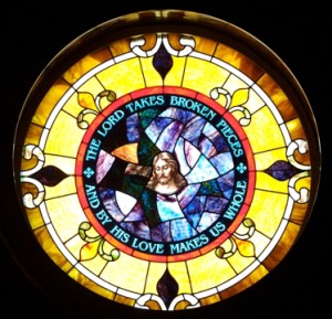 Salvaged from the bomb-blasted fragments, the window places Christ at the center of all and declares: "The Lord takes broken pieces and by His loves makes us whole."