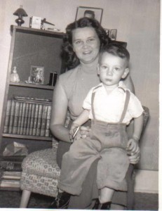 An early photo of my mom with my brother.